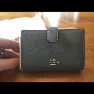 Brand new with tags Coach wallet, grey.